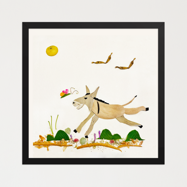 Donkey-like figure mid-leap built from light wood-toned botanicals and a soft landscape on white. Botanical wall art by FloraFusion.