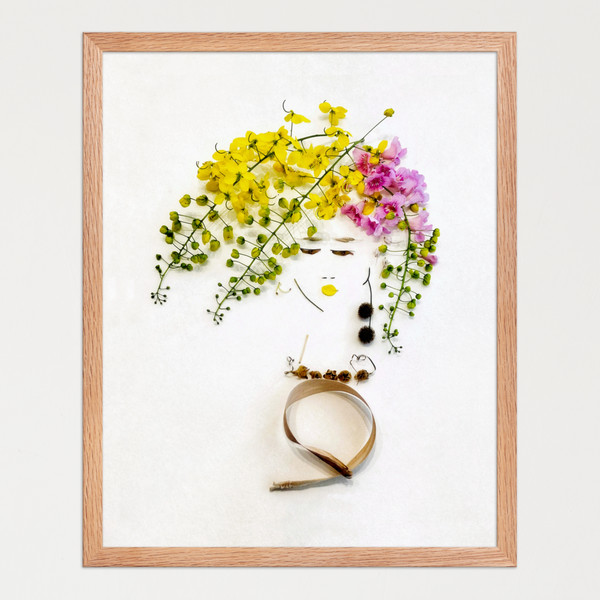 Feminine face suggested in minimal lines with soft yellow, blush pink, and green floral hair. Botanical wall art by FloraFusion.