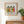 Garden Sisters botanical wall art print in a red oak frame, shown in a calm neutral room