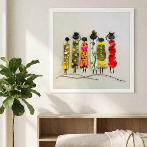 Garden Sisters botanical wall art print in a white frame, shown in a calm neutral room
