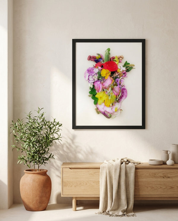 Heart in Bloom botanical wall art print in a black frame, shown in a calm neutral room