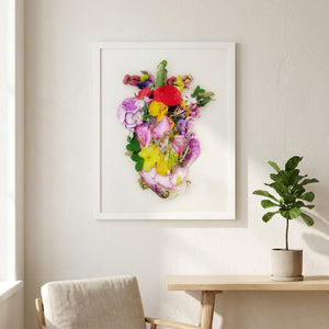 Heart in Bloom botanical wall art print in a white frame, shown in a calm neutral room