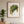 Golden Leaf botanical wall art print in a red oak frame, shown in a calm neutral room