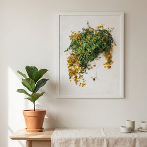 Golden Leaf botanical wall art print in a white frame, shown in a calm neutral room