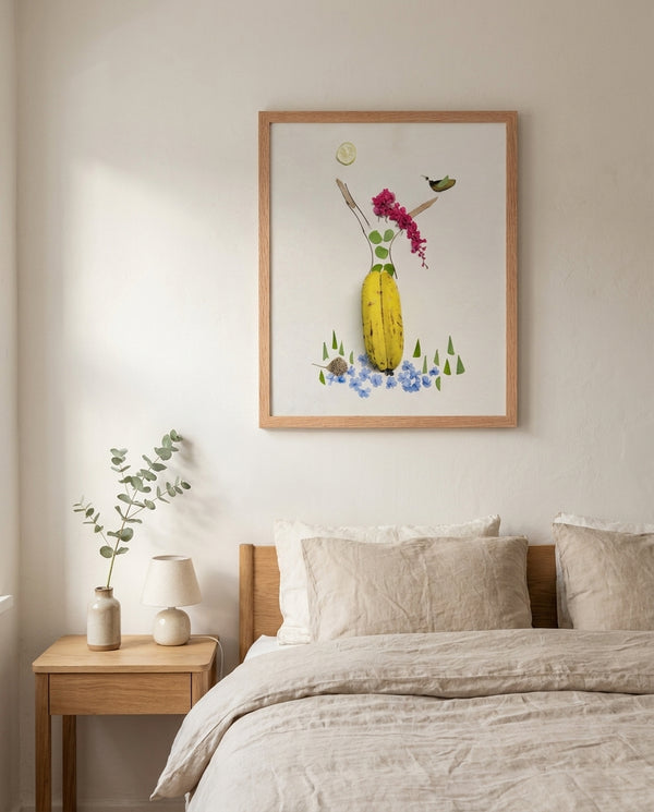 Banana Bloom print in a red oak wood frame styled in a bedroom. FloraFusion.