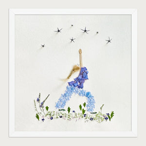 Blue Petal Balance botanical feminine wall art print in a white frame on a warm cream background