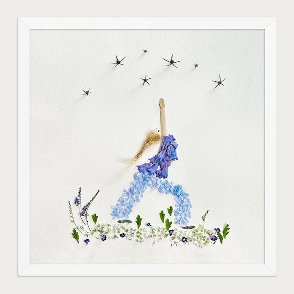 Blue Petal Balance botanical feminine wall art print in a white frame on a warm cream background