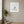 Blue Petal Balance print in a white frame hanging in a yoga studio