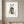 Botanical Cat Portrait art in a white frame hanging in a nursery