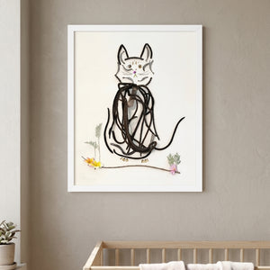 Botanical Cat Portrait art in a white frame hanging in a nursery