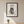Botanical Cat Portrait art in a black frame hanging in a kids room
