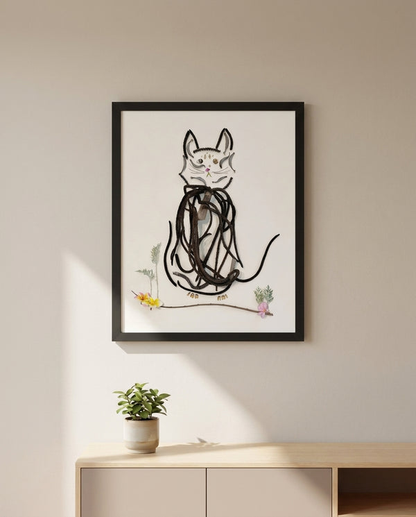 Botanical Cat Portrait art in a black frame hanging in a kids room