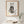 Botanical Cat Portrait art in a red oak frame hanging in a bathroom