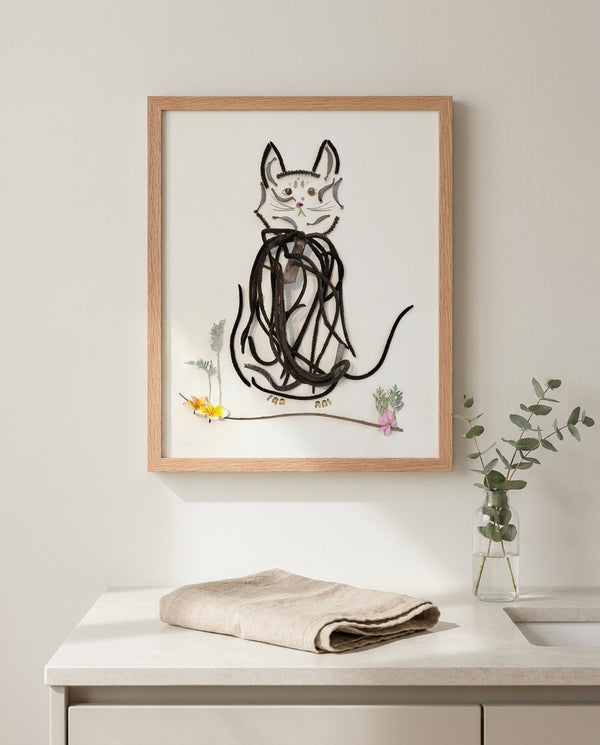 Botanical Cat Portrait art in a red oak frame hanging in a bathroom