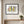 Botanical Gathering print in a black frame styled in an entryway. FloraFusion.