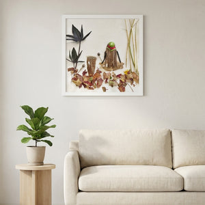 Braided by Nature in a white frame hanging in a serene living room. FloraFusion botanical wall art.