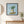 Breezy Island Moment in a black frame styled in an entryway. FloraFusion botanical wall art.