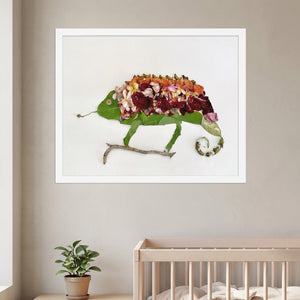 Chameleon in Bloom art in a white frame hanging in a nursery