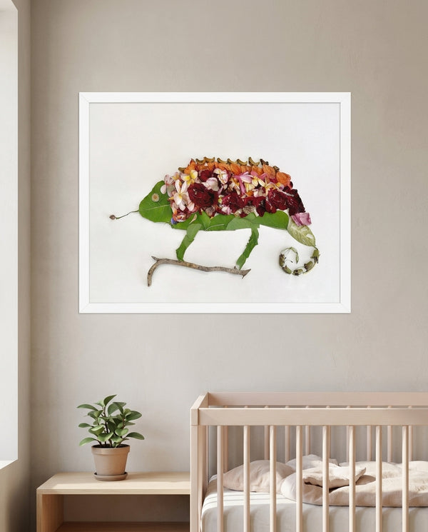 Chameleon in Bloom art in a white frame hanging in a nursery