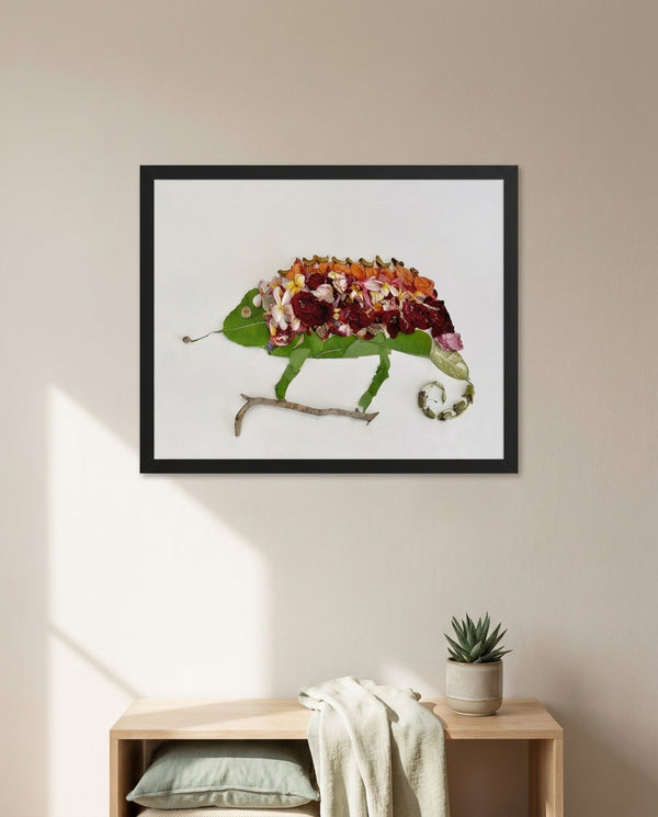 Chameleon in Bloom art in a black frame hanging in a kids room