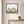 Cypress Afternoon nature-inspired park scene wall art print in a black frame hanging in an entryway