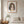 Earthbound Lady in a red oak frame styled in a bedroom. FloraFusion botanical wall art.