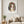 Earthbound Lady in a white frame hanging in a serene living room. FloraFusion botanical wall art.