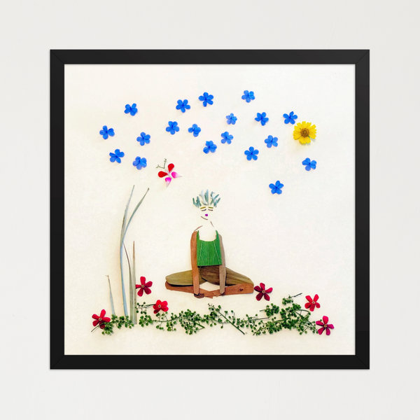 Seated feminine figure of leaves and wood-like elements under arcing blue petals and a yellow bloom. Botanical wall art by FloraFusion.