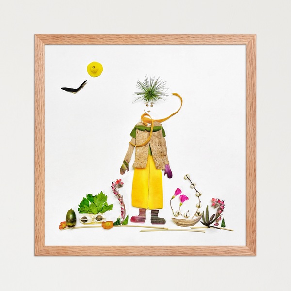 Solitary figure shaped from leaves, citrus peel, seeds, and plant fibers on a white background. Botanical wall art by FloraFusion.