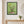 First Blossoms botanical spring tree wall art print in a black frame hanging in an entryway