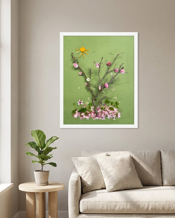 First Blossoms botanical spring tree wall art print in a white frame hanging in a living room
