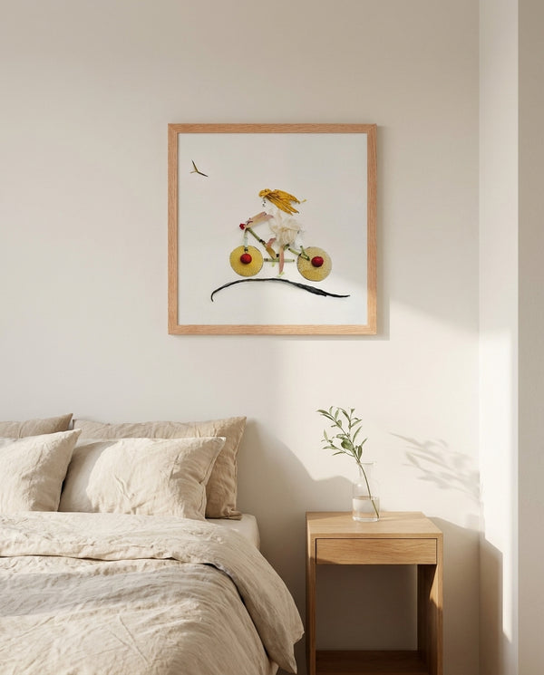 Garden Bicycle art print in a red oak frame in a serene bedroom