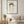 Garden Crown Lady art print in a black frame in a modern living room