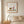 Garden Day Journey art print in a red oak frame in a serene bedroom
