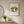 Garden Halo Lady in a red oak frame in a warm entryway with a round mirror