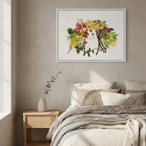 Garden Halo Lady in a white frame styled above a bed in a serene bedroom
