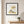Garden Tender in a black frame in a serene entryway with a round mirror