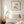 Garden Tender in a red oak frame above a bed in a restful bedroom