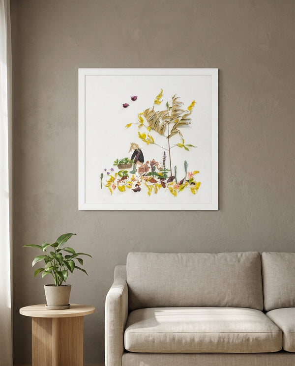 Garden Tender in a white frame above a linen sofa in a calm living room