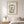 Garden Window Home art in a red oak frame hanging in a bedroom