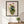 Gathered Bouquet floral still life wall art print in a black frame hanging in an entryway