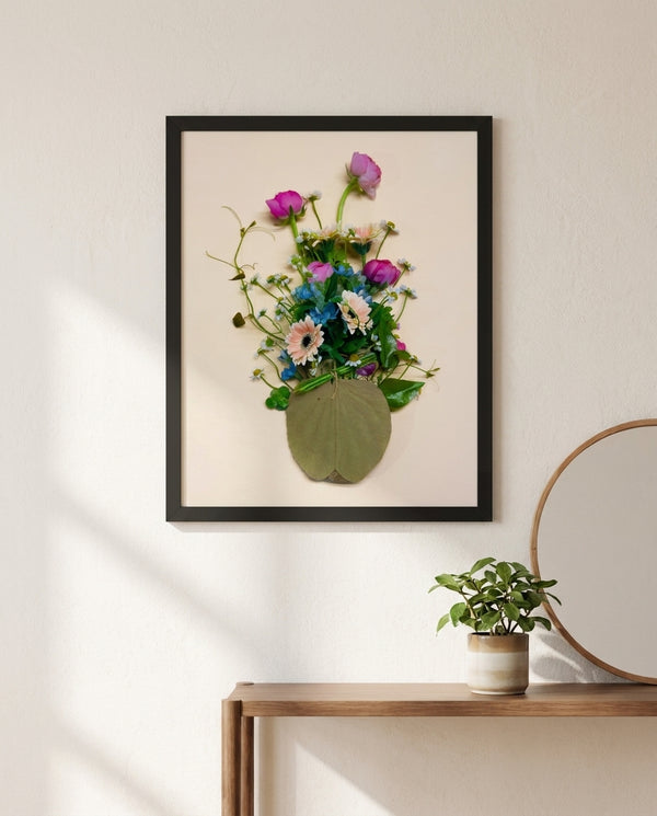 Gathered Bouquet floral still life wall art print in a black frame hanging in an entryway