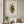 Gathered Bouquet floral still life wall art print in a white frame hanging in a living room