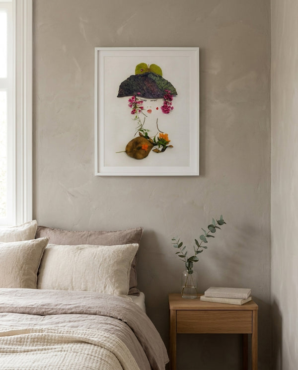 A Gentle Flourish in a white frame hung in a serene bedroom