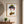 A Gentle Flourish in a red oak frame in an entryway