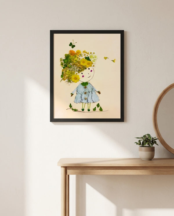 Girl in Bloom whimsical floral girl wall art print in a black frame hanging in an entryway