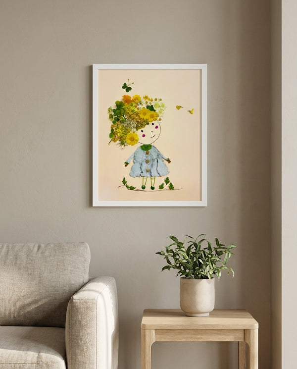 Girl in Bloom whimsical floral girl wall art print in a white frame hanging in a living room