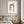 Golden Dates Portrait art in a white frame hanging in a bedroom