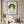 Green Meadow Lady in a black frame above a linen sofa in a calm living room