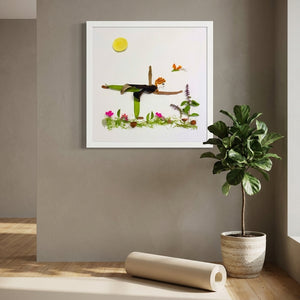 Grounded in Light art in a white frame hung in a serene yoga studio